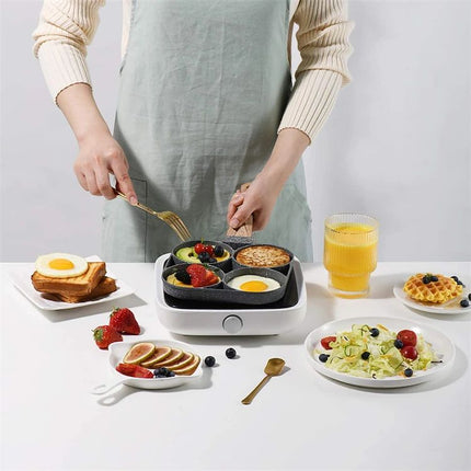 Person preparing breakfast with a multi-section frying pan on a white table.